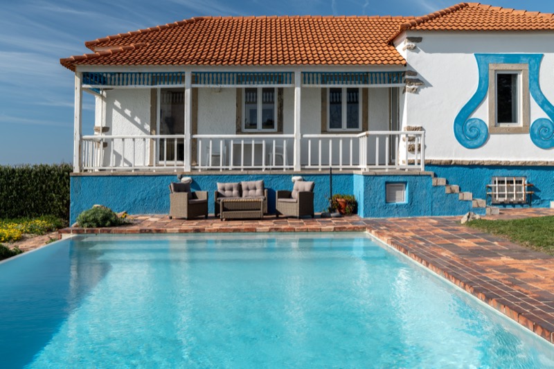 The veranda and pool of the villa in full daylight